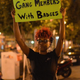 A woman holds a sign during a protest in St. Louis Aug. 20, 2015.
Michael B. Thomas/Getty Images
